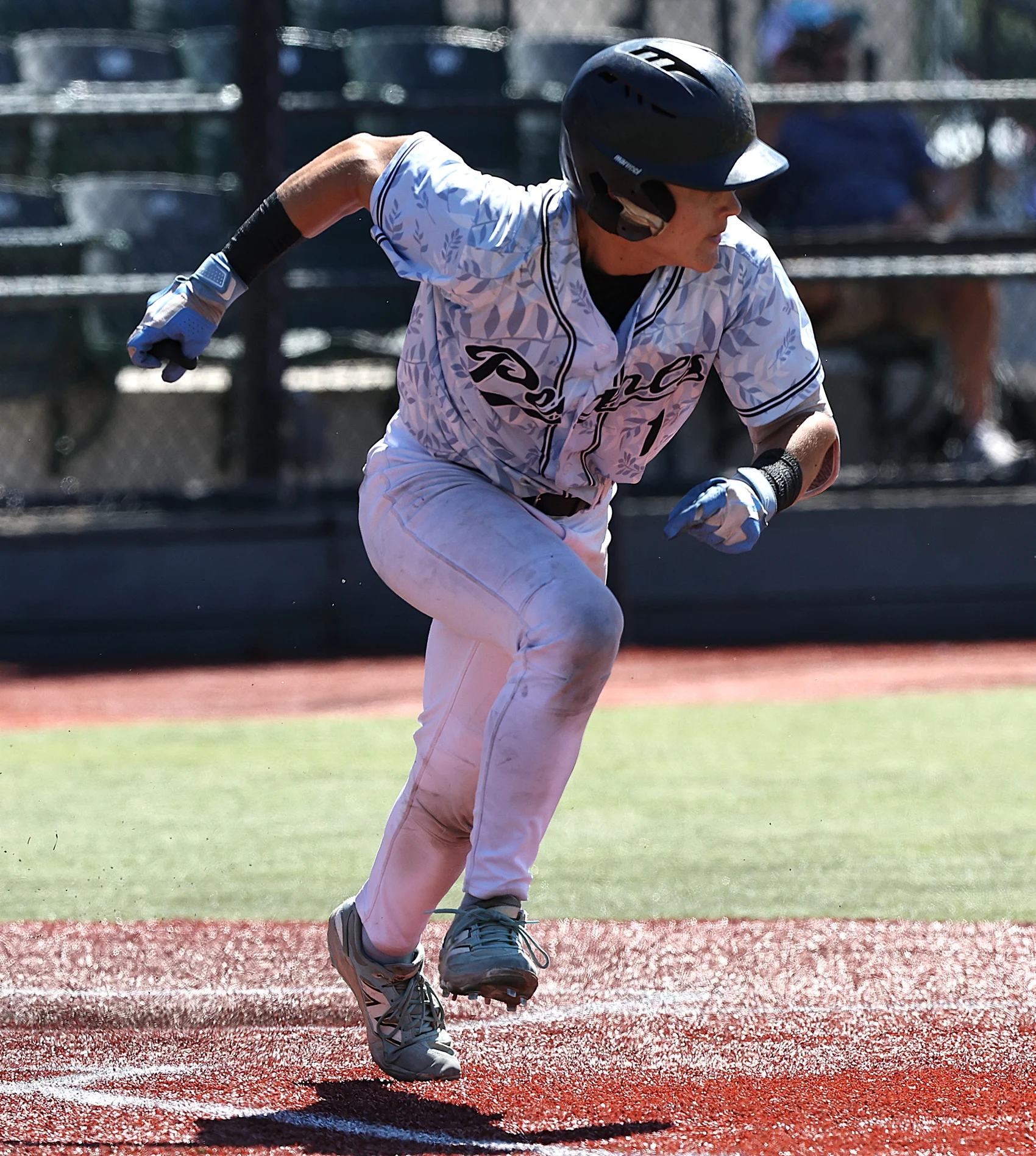 A Stockton Pearls collegiate player exploding out of the batter’s box at the 2026 BACL All-Star game